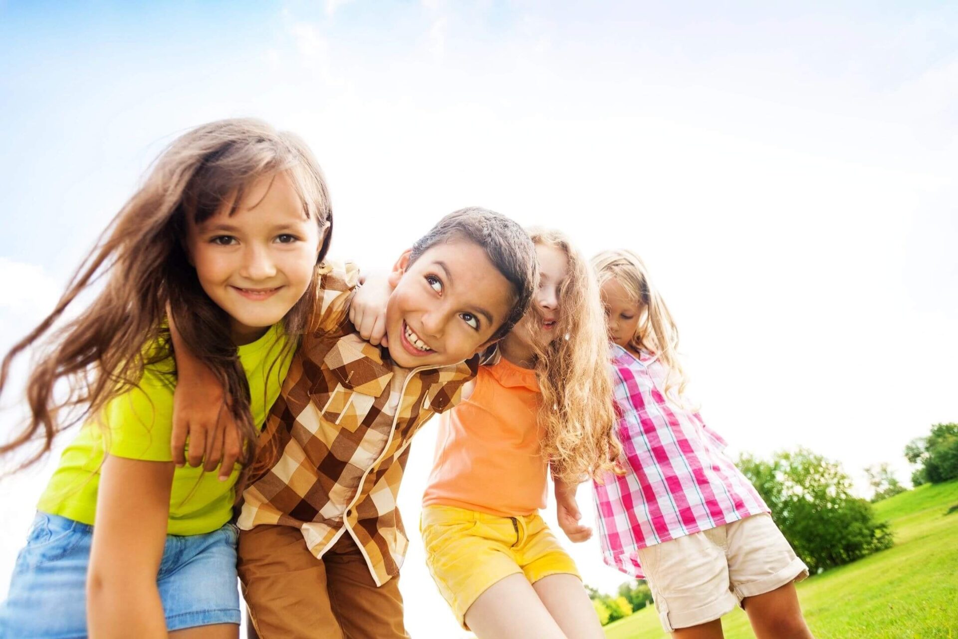 A group of young children standing next to each other.